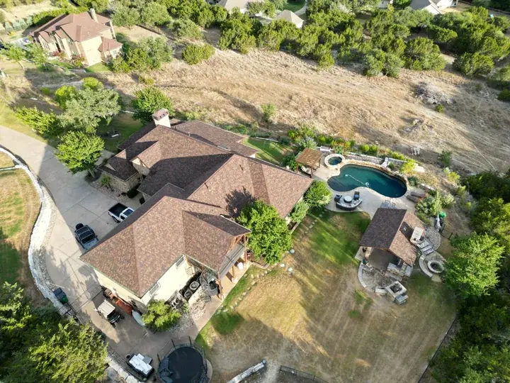 Aerial view of a Texas home roof replaced after hail damage